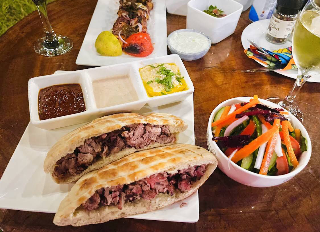 Grilled steak pita with three dips and a crunchy salad